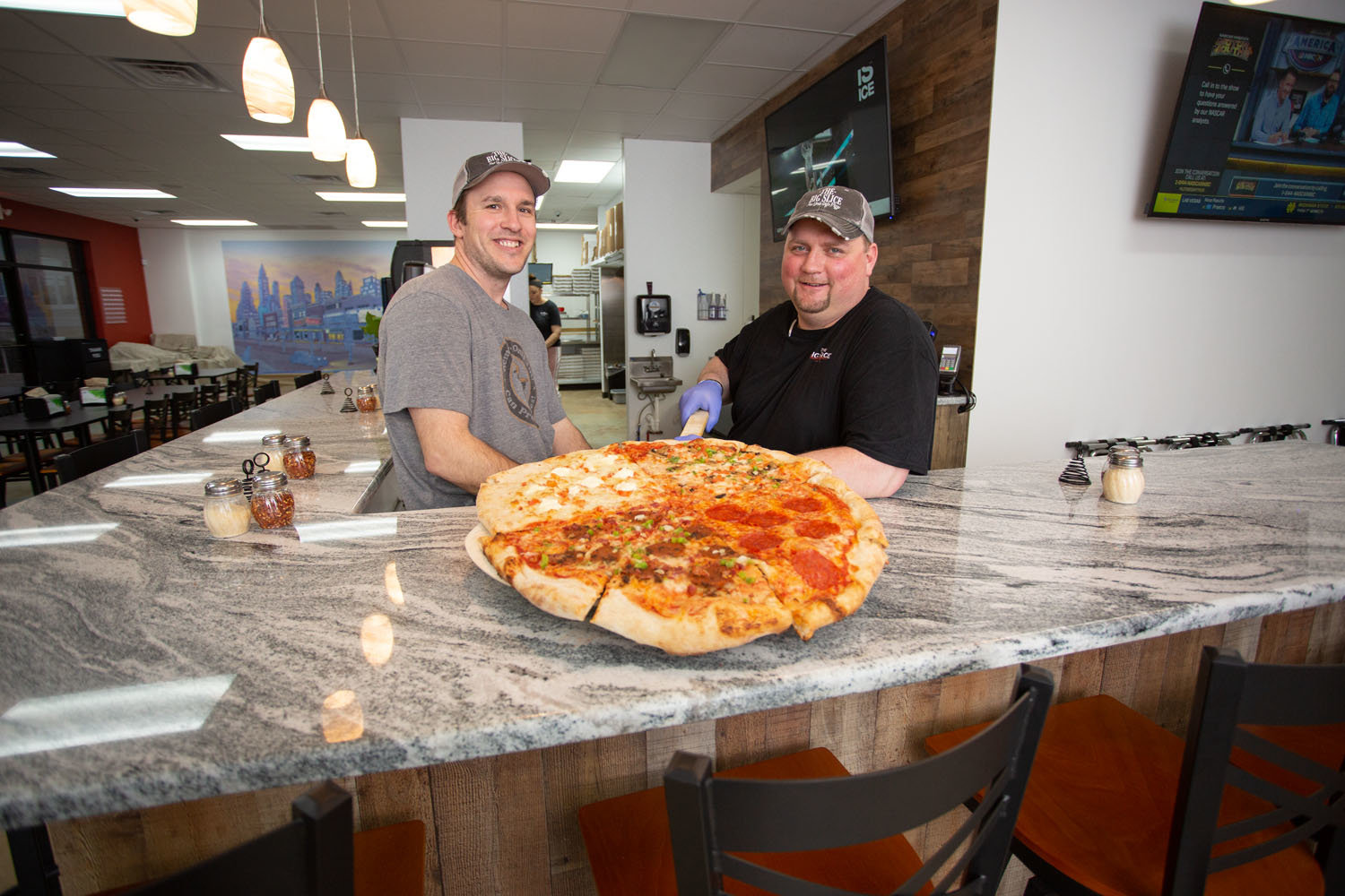 FOOD FRANCHISE: The Big Slice owner Levi Grant, left, is working to franchise the concept, starting with Justin Kennedy as a partner.